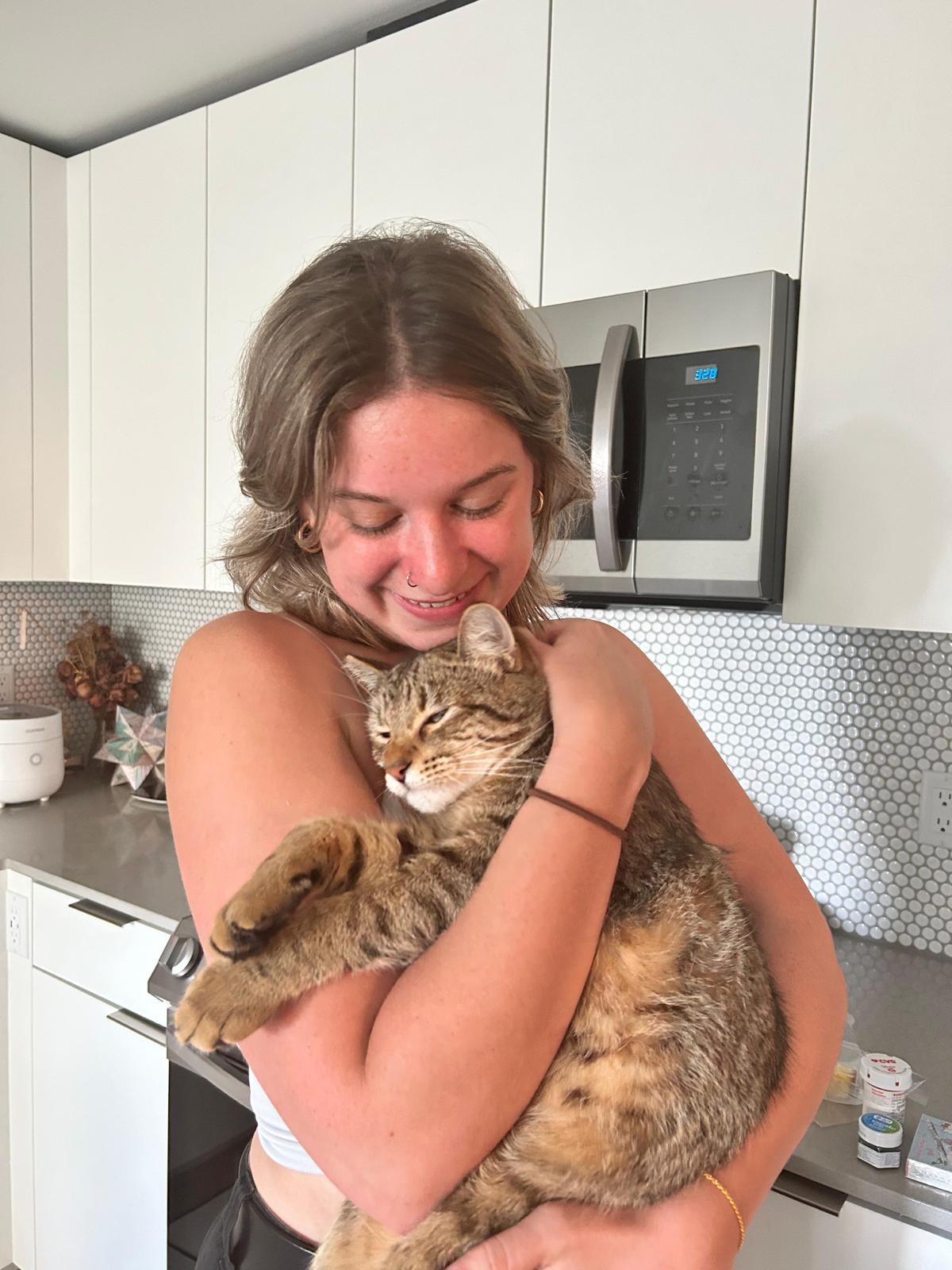 Photo of Sara Luxmoore (with a cat!)